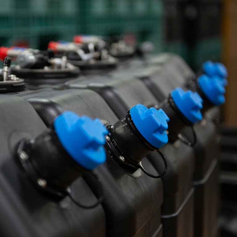 Multiple rotomolded black DEF tanks